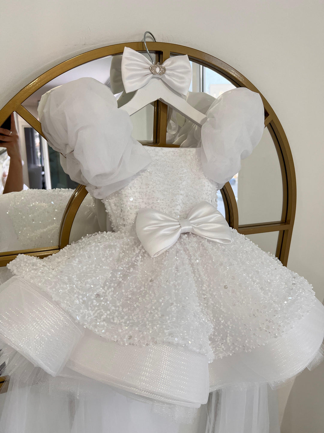Aleena Children’s dress with long bridal train. In white sparkle glass beads and sequins. Perfect for as a christening dress, flower girls dress, baptism outfit, communion dress.
