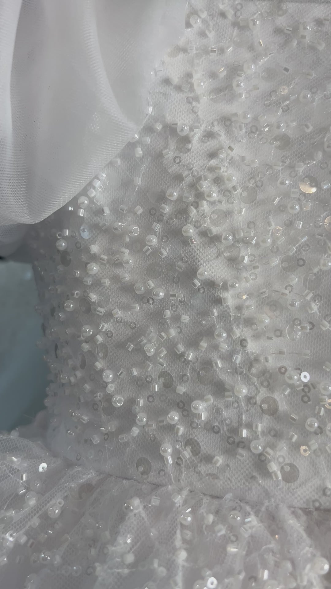 Aleena Children’s dress with long bridal train. In white sparkle glass beads and sequins. Perfect for as a christening dress, flower girls dress, baptism outfit, communion dress.