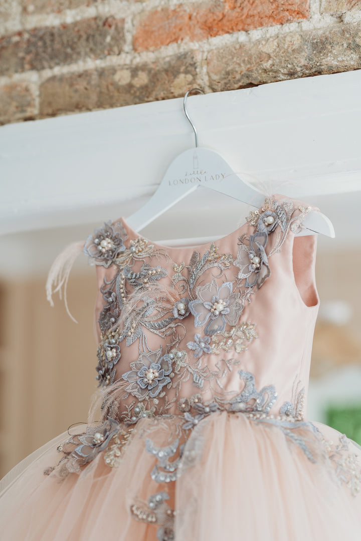 Designer Couture Childrens Dress with train. Hand sewn 3D Flowers, pearls and sequins Bodice with a short blush Ballerina tutu skirt. Long Tulle detachable train for that WOW factor . Fully lined in cotton for ultimate comfort