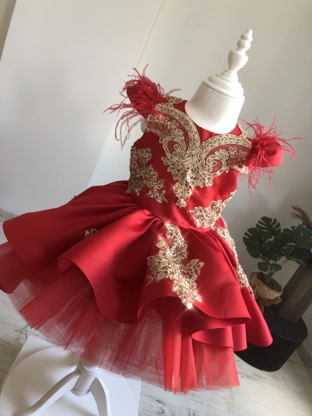 Short Maroon bridal Satin, Custom Couture Flower girl Dress. Luxury Maroon Satin and Gold 3D Lace Appliques with beautifiul Feather Sleeves.  Lots of tulle to give huge volume in the skirt. Fully lined in cotton for comfort. Ideal Birthday party dress for children.