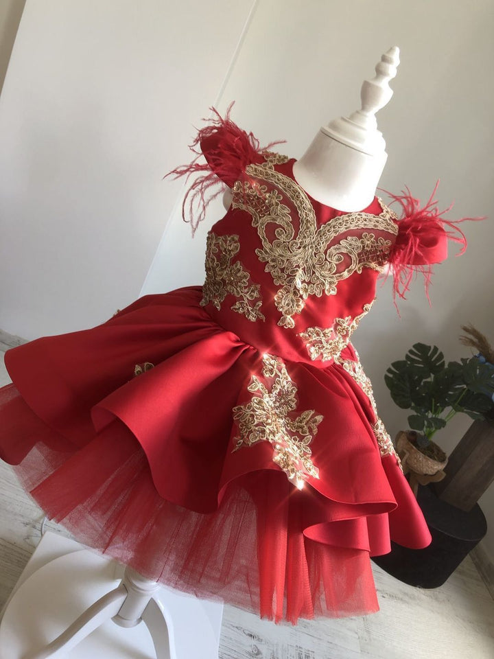 Short Maroon bridal Satin, Custom Couture Flower girl Dress. Luxury Maroon Satin and Gold 3D Lace Appliques with beautifiul Feather Sleeves.  Lots of tulle to give huge volume in the skirt. Fully lined in cotton for comfort. Ideal Birthday party dress for children.