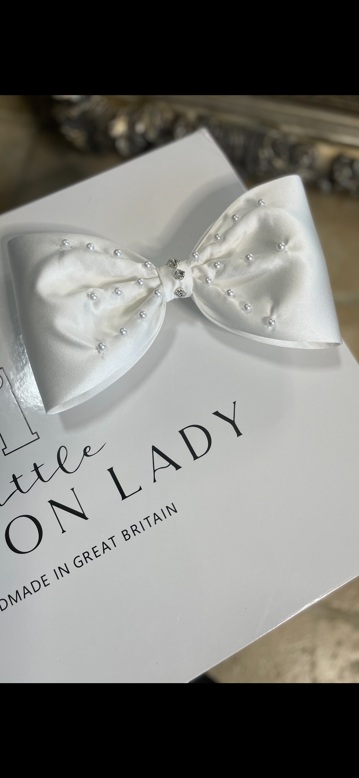 The Sofia dress detachable back bow. Luxury packaging from Litttle London Lady. All dresses come with free UK delivery.