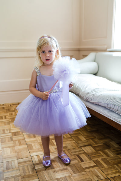 The SweetPea tutu dress in Lilac Lavender.  Each dress has 3  Crystal Rhinestone Embellishments. , large, soft Black Satin Bow and long Black Satin Tails , Black satin Hair clip, makes the perfect Baby Dress, Baby Tutu Dress,. Luxury childrens pink tutu dress with large Pink satin oversized bow and sparkling crystal embellishments.
