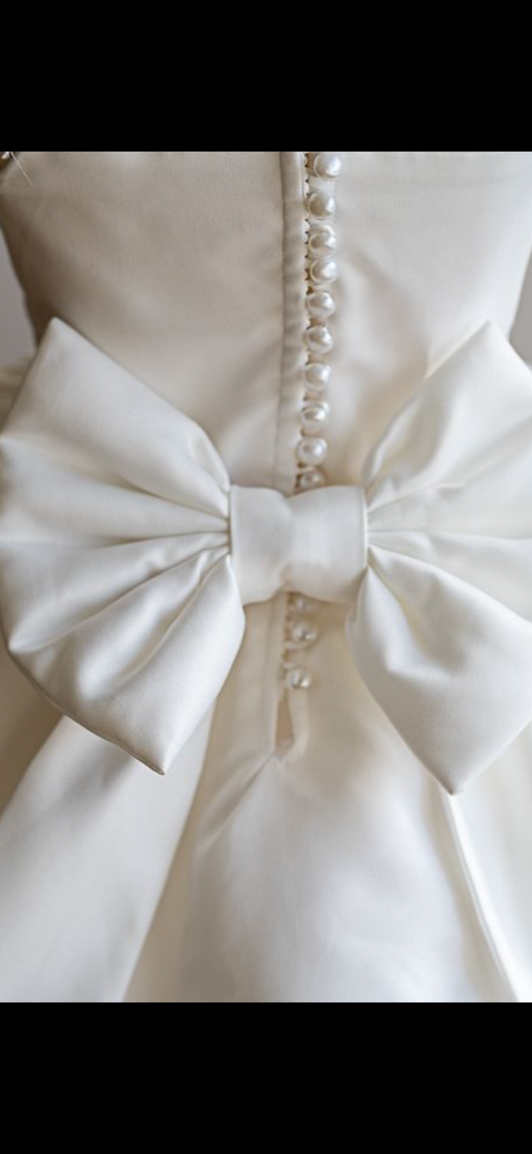 Satin Bow on Childrens occasion dress.