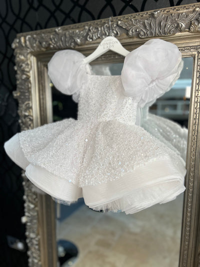 Aleena Children’s dress with long bridal train. In white sparkle glass beads and sequins. Perfect for as a christening dress, flower girls dress, baptism outfit, communion dress. 
